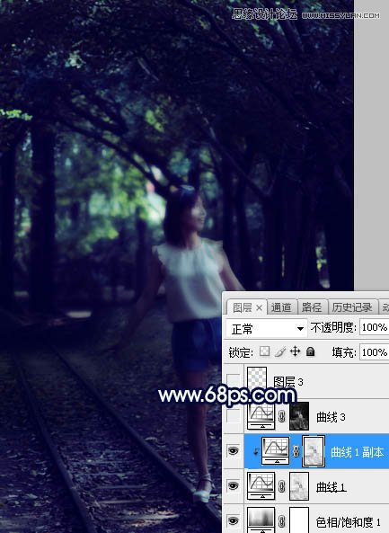 PS调色调出唯美蓝色逆光效果的树下美女照片