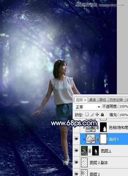 PS调色调出唯美蓝色逆光效果的树下美女照片